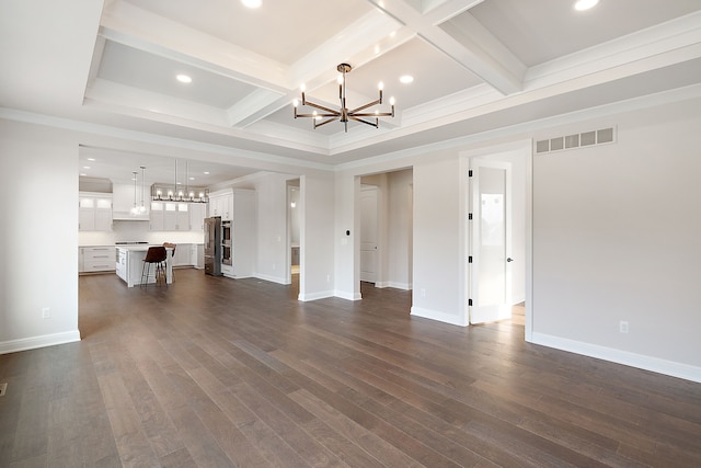 unfurnished living room featuring dark hardwood / wood-style floors, crown molding, coffered ceiling, and a notable chandelier