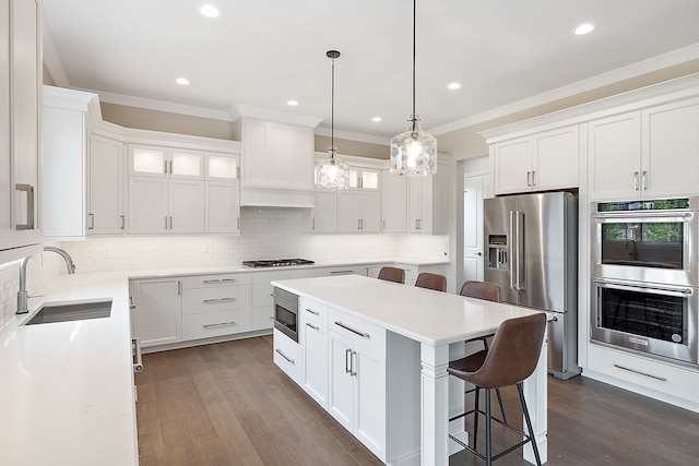 kitchen with sink, white cabinetry, and stainless steel appliances