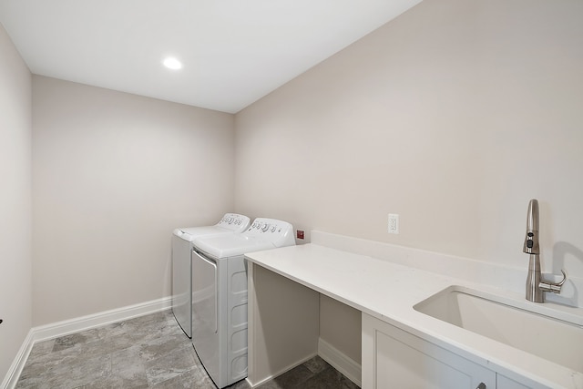 laundry room with sink and washing machine and clothes dryer