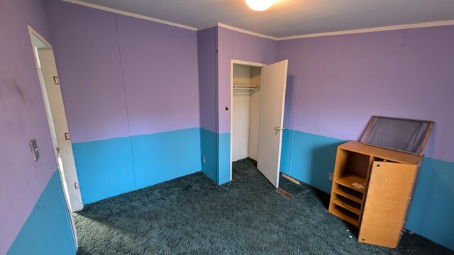6259 N Custer Rd, Michigan, MI 49411 - unfurnished bedroom with carpet and crown molding