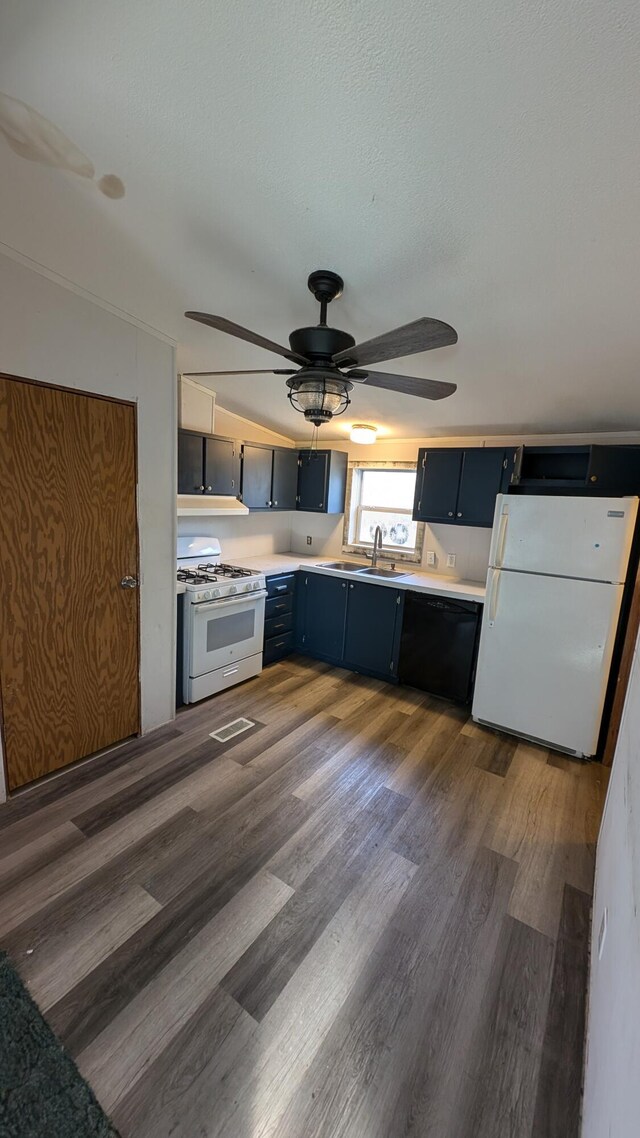 6259 N Custer Rd, Michigan, MI 49411 - kitchen with white appliances, blue cabinetry, light countertops, and dark wood-style flooring