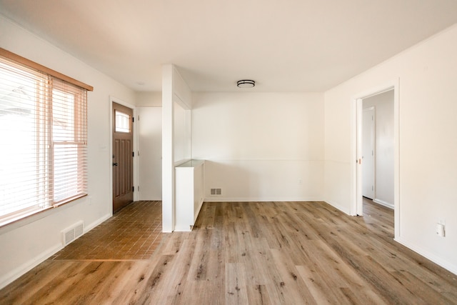 foyer entrance with light wood-type flooring