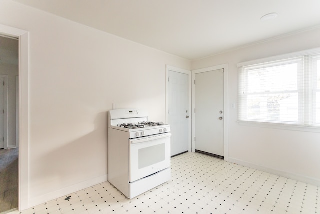 kitchen with white gas range