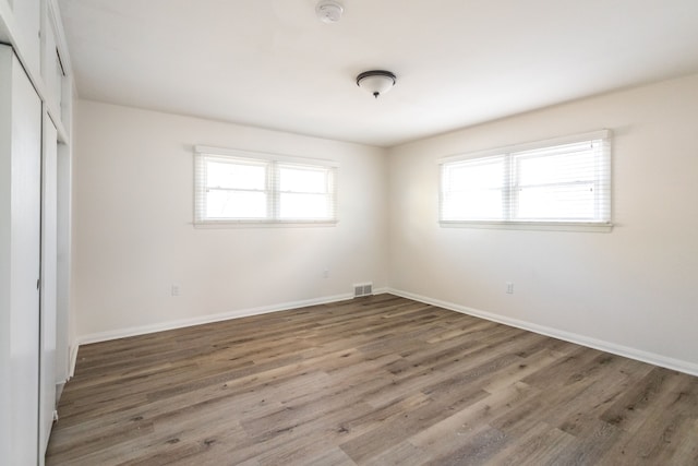 unfurnished bedroom featuring dark wood-type flooring