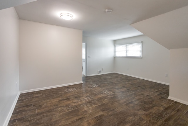 bonus room featuring dark hardwood / wood-style flooring