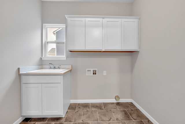 laundry area with sink, cabinets, and hookup for a washing machine