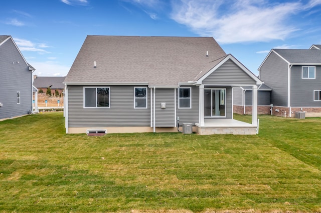 rear view of property with a patio, a yard, and central AC unit