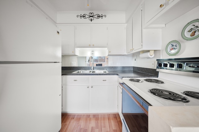 kitchen featuring backsplash, white appliances, sink, light hardwood / wood-style flooring, and white cabinets