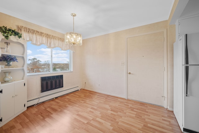 unfurnished dining area featuring a notable chandelier, light wood-type flooring, crown molding, and a baseboard radiator