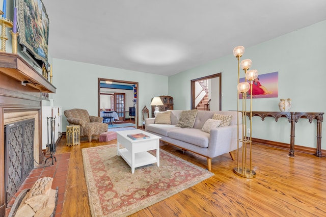 living room featuring hardwood / wood-style floors and a notable chandelier