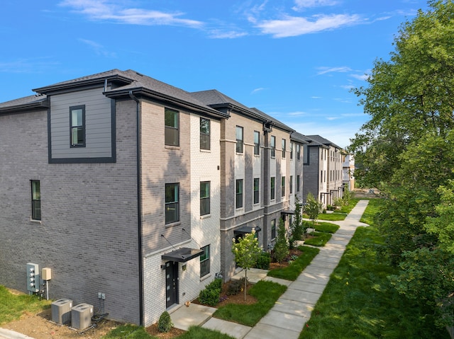 view of building exterior with cooling unit