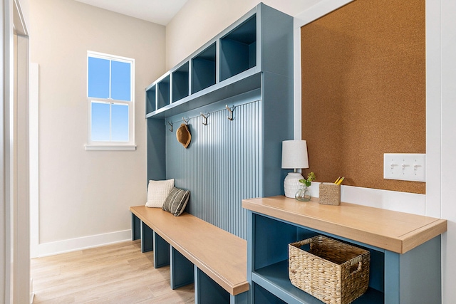 mudroom with light hardwood / wood-style floors