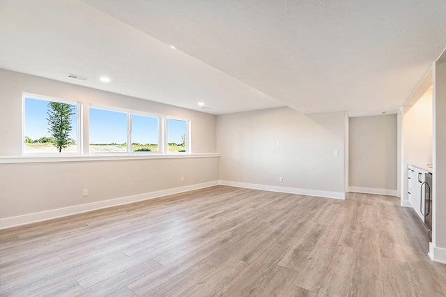 empty room with light wood-type flooring