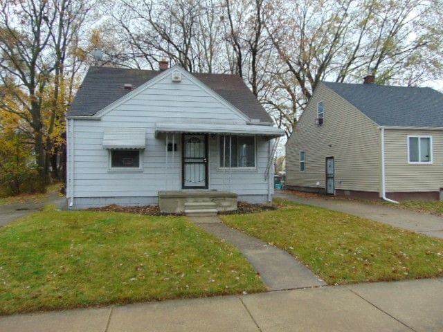 bungalow with a front yard