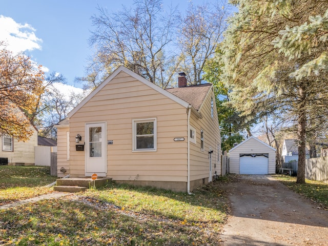 bungalow-style house with an outbuilding and a garage