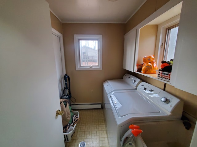 washroom with independent washer and dryer and a baseboard heating unit