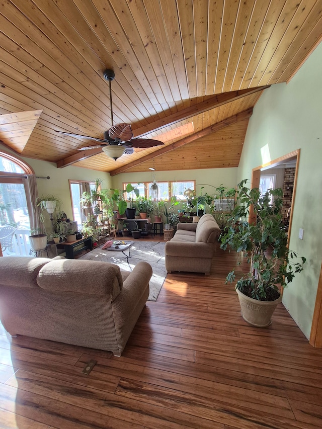 living room featuring vaulted ceiling with beams, hardwood / wood-style flooring, wooden ceiling, and ceiling fan