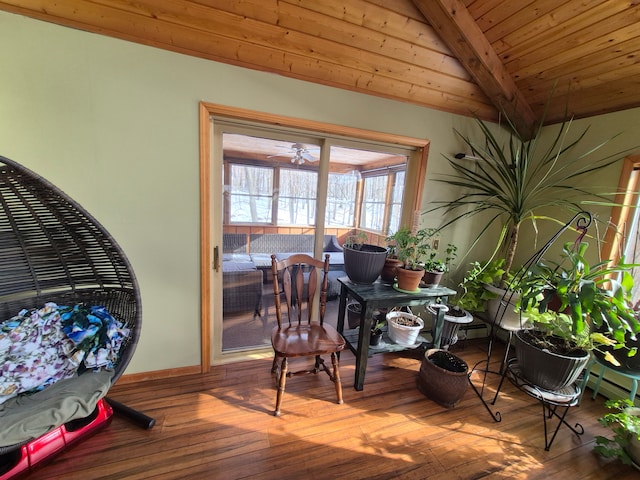 interior space with beamed ceiling, ceiling fan, wood ceiling, and hardwood / wood-style floors