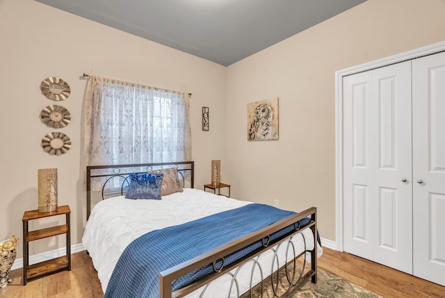 bedroom featuring a closet and hardwood / wood-style floors