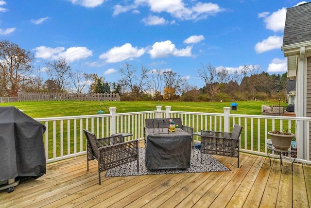 deck with a grill and a yard