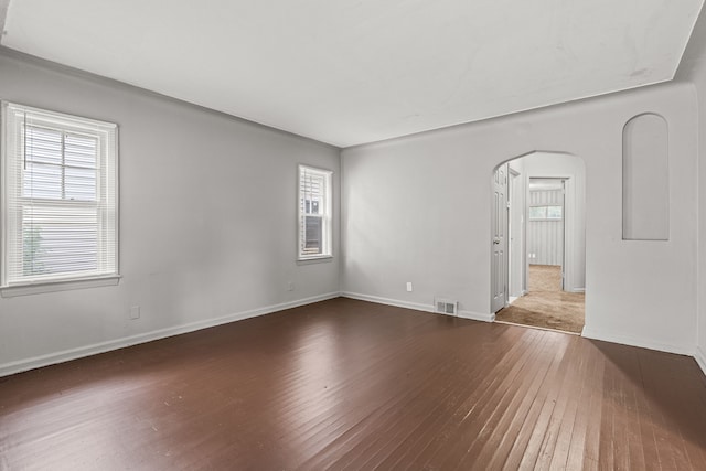 spare room featuring dark hardwood / wood-style flooring