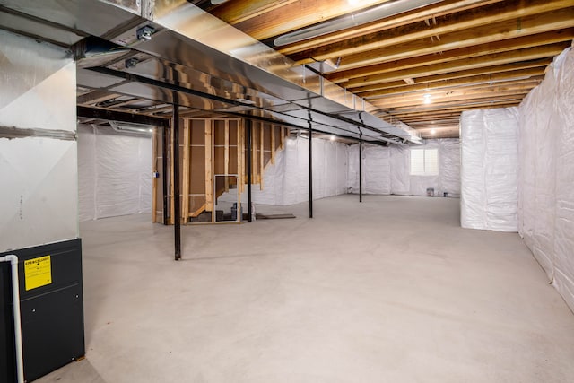 basement featuring heating unit