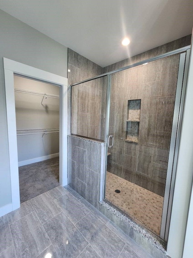 bathroom featuring an enclosed shower