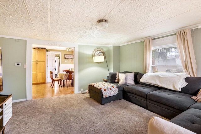 carpeted living room featuring ornamental molding and a textured ceiling