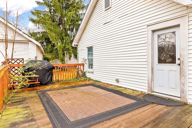 wooden deck with grilling area