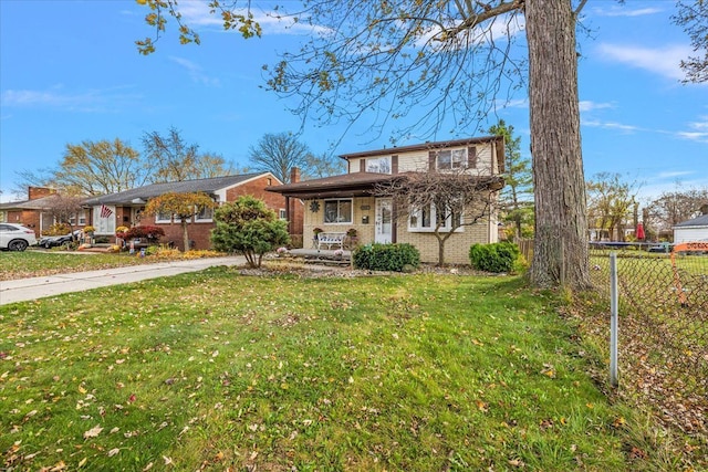 view of front of property featuring a porch and a front lawn