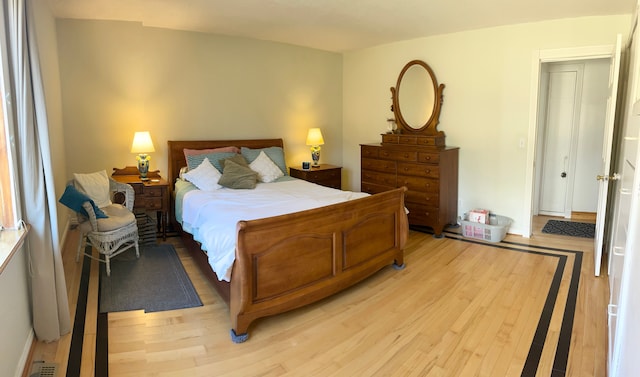 bedroom with light wood-type flooring