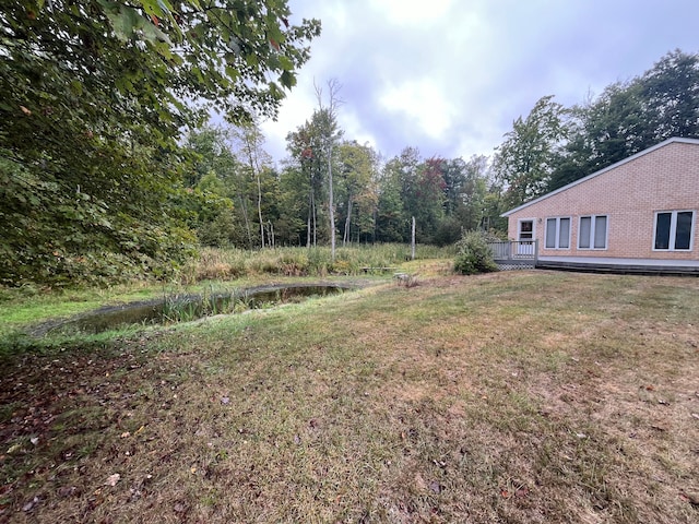 view of yard featuring a deck