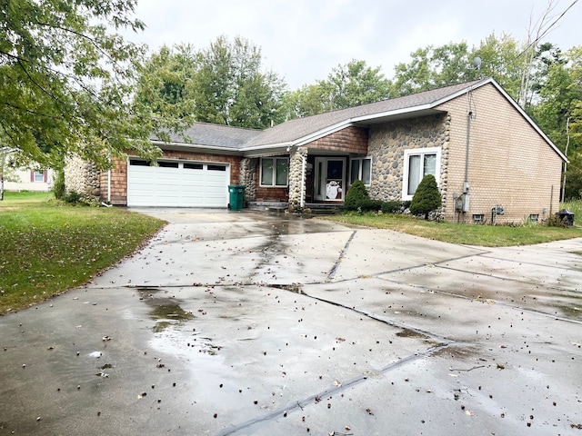 view of front of home with a front yard and a garage