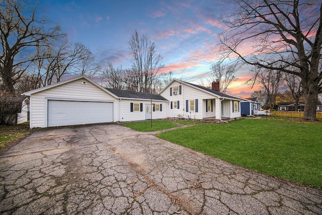 ranch-style house with a lawn and a garage