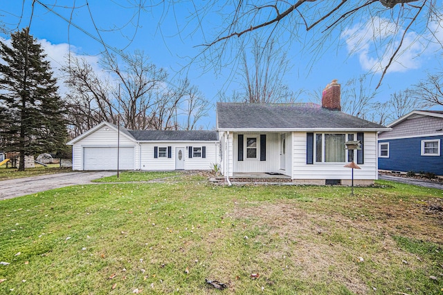 single story home with a garage and a front lawn