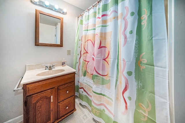 bathroom with a shower with shower curtain and vanity