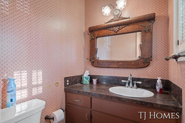 bathroom with vanity and toilet