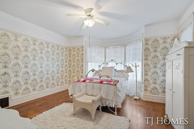 bedroom featuring dark hardwood / wood-style floors and ceiling fan