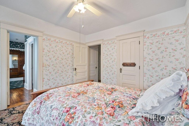 bedroom featuring hardwood / wood-style floors and ceiling fan