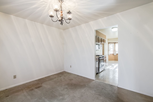 spare room with light carpet and a notable chandelier