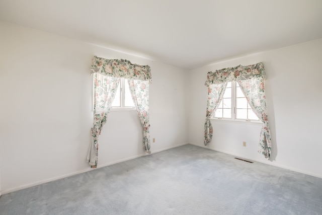 unfurnished room featuring carpet