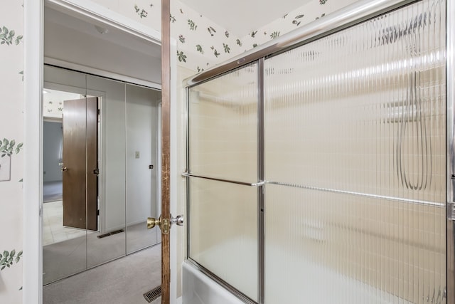 bathroom featuring enclosed tub / shower combo