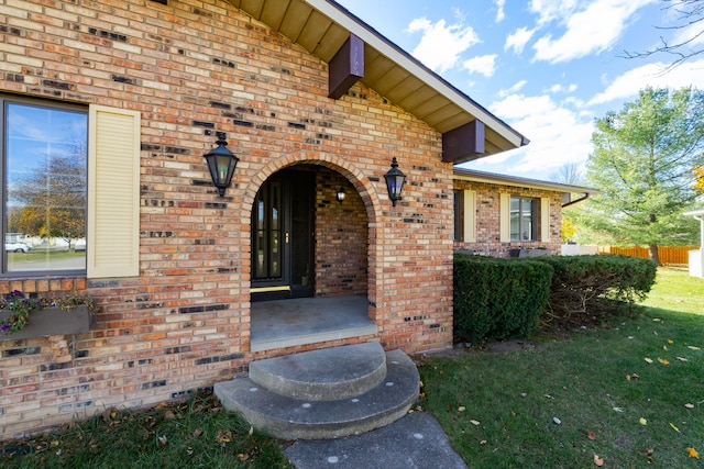 entrance to property with a yard