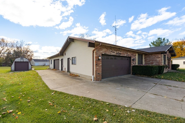 view of side of property with a yard and a garage