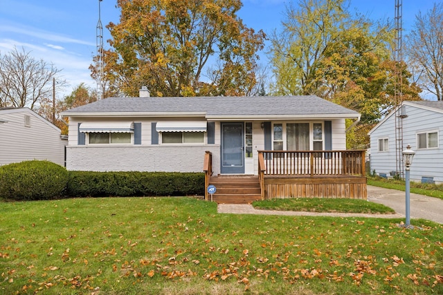 view of front of home with a front yard and a porch