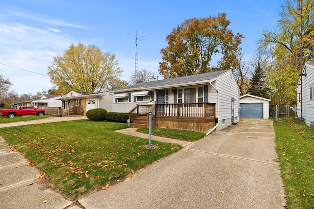 view of front of property with an outbuilding, a garage, a front lawn, and covered porch