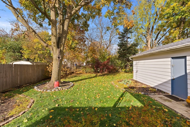 view of yard featuring a fenced backyard and an outdoor structure