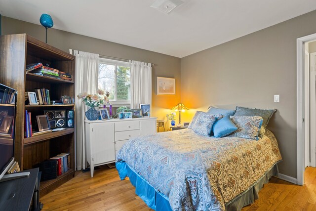 bedroom with light hardwood / wood-style floors