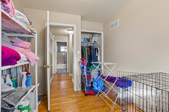 spacious closet with visible vents and wood finished floors