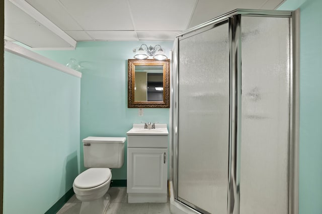 full bath featuring toilet, vanity, baseboards, a shower stall, and tile patterned floors